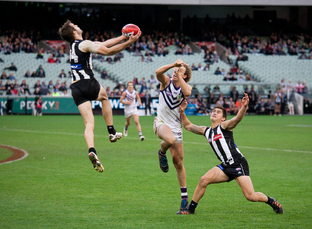 MELBOURNE - JUNE 30 : Alan Tookey rushes in to take a mark during Collingwood's win over Fremantle on June 30, 2012 in Melbourne, Australia.