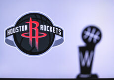 Houston Rockets Basketball club on the white screen. Silhouette of NBA trophy in foreground.
