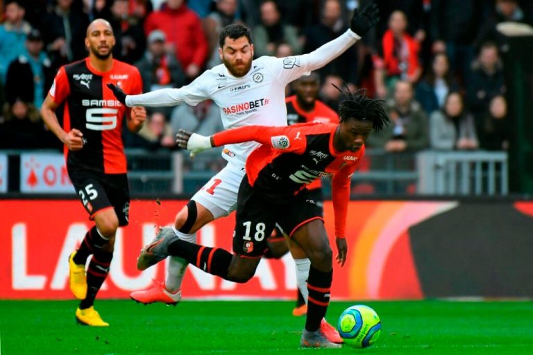 Rennes French midfielder Eduardo Camavinga (R) vies with Montpelliers French midfielder Teji Savanier (C) during the French L1 football match between Stade Rennais Football Club and Montpellier Herault SC at the Roazhon Park, in Rennes, northwestern France, on March 8, 2020.
